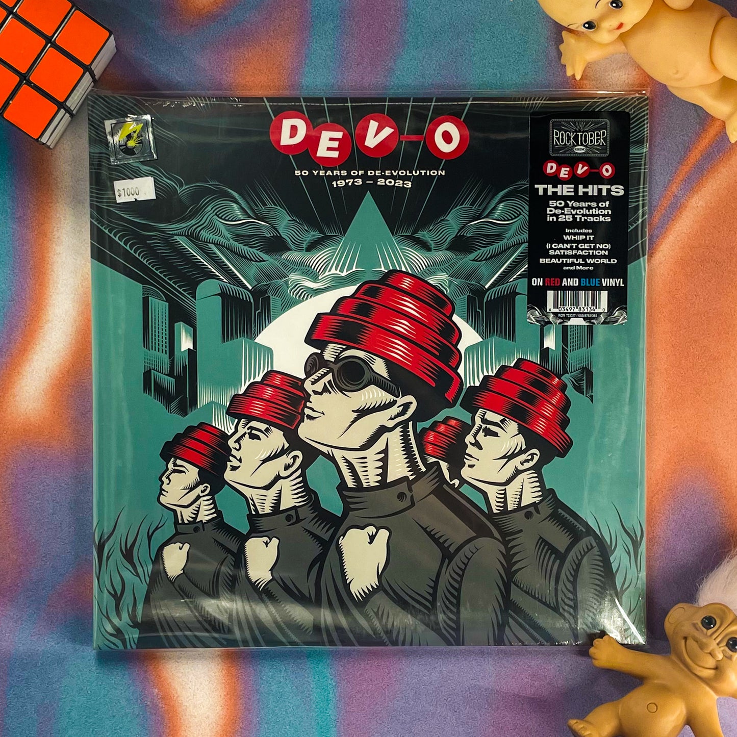 DEVO - 50 YEARS OF DE-EVOLUTION “THE HITS” (RED AND BLUE)